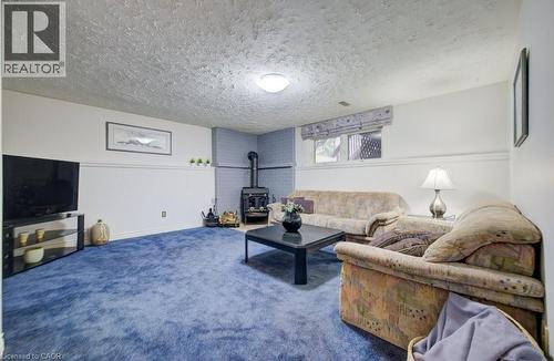 27 Erinbrook Drive, Kitchener, ON - Indoor Photo Showing Living Room With Fireplace