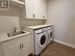 Laundry room with new washer & dryer - 