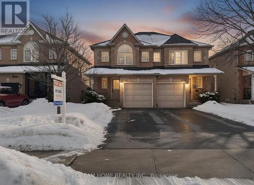 Stunning brick home at dusk with driveway - 3746 Windhaven Drive, Mississauga, ON - Outdoor With Facade