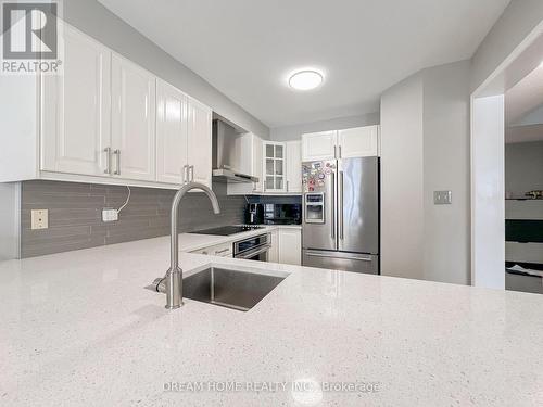 Spacious island with sleek cabinetry - 3746 Windhaven Drive, Mississauga, ON - Indoor Photo Showing Kitchen With Stainless Steel Kitchen With Upgraded Kitchen