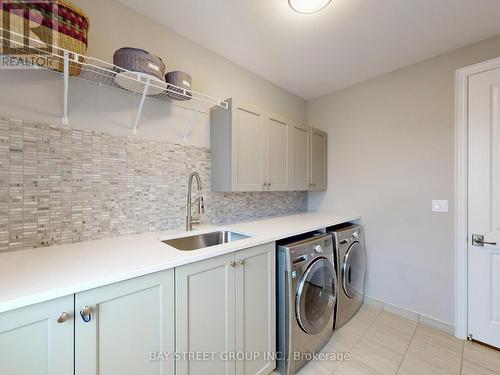 Modern Laundry with Quartz Counters - 39 Cairns Gate, King, ON - Indoor Photo Showing Laundry Room