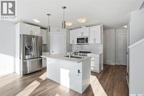 111 Stromberg Crescent, Saskatoon, SK - Indoor Photo Showing Kitchen With Double Sink With Upgraded Kitchen