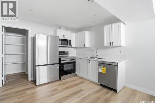 111 Stromberg Crescent, Saskatoon, SK - Indoor Photo Showing Kitchen With Double Sink