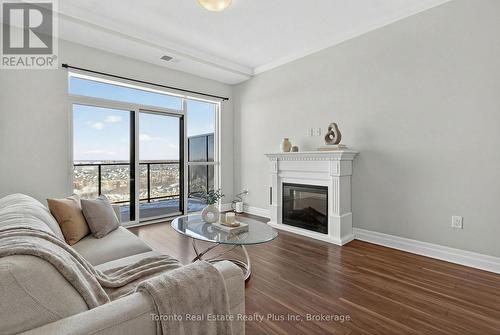1109 - 260 Villagewalk Boulevard, London North, ON - Indoor Photo Showing Living Room With Fireplace