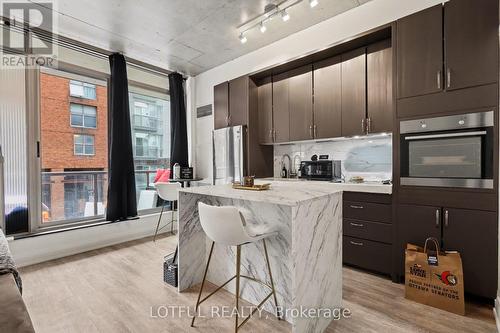 201 - 383 Cumberland Street, Ottawa, ON - Indoor Photo Showing Kitchen With Upgraded Kitchen