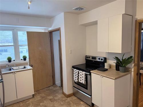 656 Renfrew Street, Winnipeg, MB - Indoor Photo Showing Kitchen With Double Sink