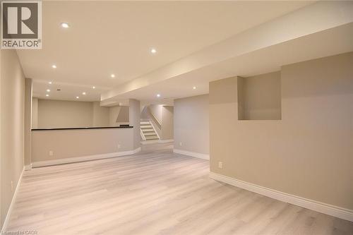 Finished below grade area with recessed lighting and light wood-style flooring - 5109 Blue Spruce Avenue, Burlington, ON - Indoor Photo Showing Other Room
