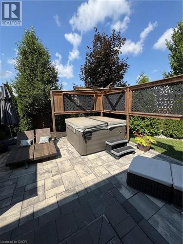 View of patio / terrace with outdoor furniture and a hot tub - 43 Freure Drive, Cambridge, ON - Outdoor With Deck Patio Veranda