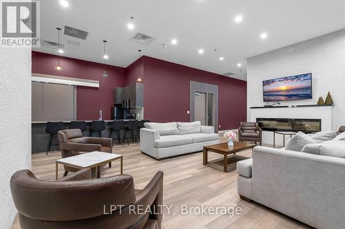 901 - 560 North Service Road N, Grimsby, ON - Indoor Photo Showing Living Room With Fireplace