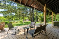 Enjoy the birdsong from under the covered deck - 