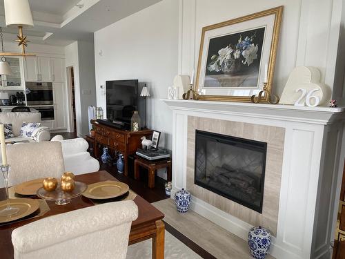 Salle à manger - 206-284 Ch. Du Bord-Du-Lac-Lakeshore, Pointe-Claire, QC - Indoor Photo Showing Living Room With Fireplace