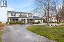 View of front of house with a front yard, a balcony, and a garage - 1073 North Service Road, Hamilton, ON  - Outdoor With Facade 
