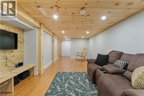 Living room featuring wood ceiling, light wood-style flooring, and recessed lighting - 115 Lakeshore Road, Port Burwell, ON - Indoor