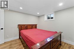 Bedroom featuring wood finished floors and recessed lighting - 