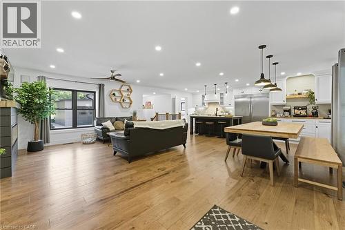 Living room with light wood finished floors, recessed lighting, and ceiling fan - 115 Lakeshore Road, Port Burwell, ON - Indoor