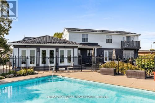 1073 North Service Road, Hamilton, ON - Outdoor With In Ground Pool With Deck Patio Veranda