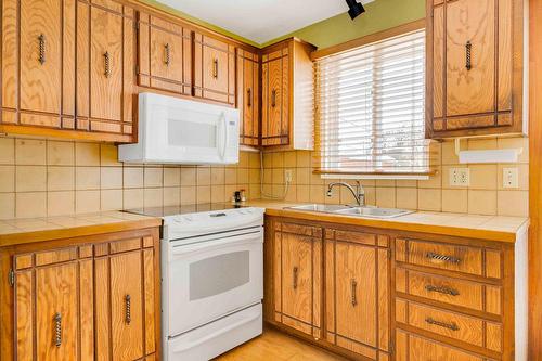 Cuisine - 3765 Rue De Cambrai, Laval (Saint-François), QC - Indoor Photo Showing Kitchen With Double Sink
