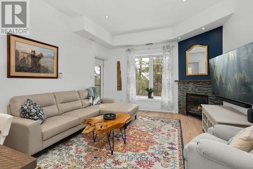402 - 391B Manitoba Street, Bracebridge (Macaulay), ON - Indoor Photo Showing Living Room With Fireplace