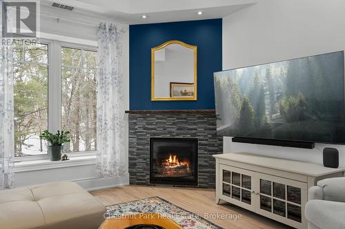 402 - 391B Manitoba Street, Bracebridge (Macaulay), ON - Indoor Photo Showing Living Room With Fireplace
