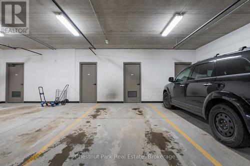 Underground Parking- Private Parking Spot & Locker - 402 - 391B Manitoba Street, Bracebridge (Macaulay), ON - Indoor Photo Showing Garage
