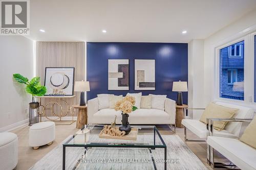 10 - 590 Sandhurst Circle, Toronto, ON - Indoor Photo Showing Living Room