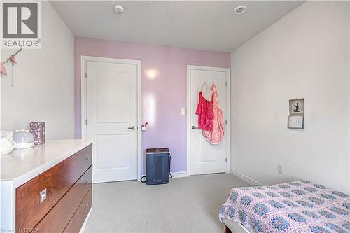 Bedroom with light colored carpet and baseboards - 29 Bellhouse Avenue, Brantford, ON - Indoor Photo Showing Bedroom