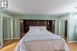 Primary bedroom with his & her closets - 