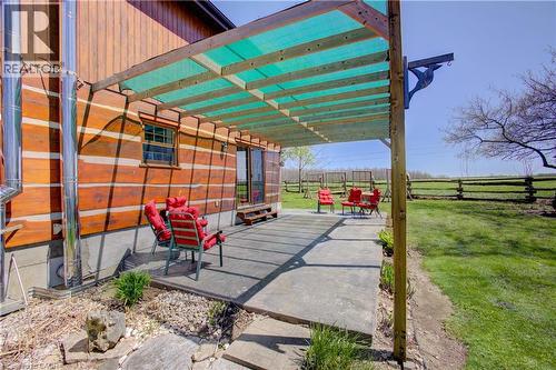 Covered rear patio with loads of room for outdoor dining and lounging - 802080 Grey Road 40, Chatsworth (Twp), ON - Outdoor