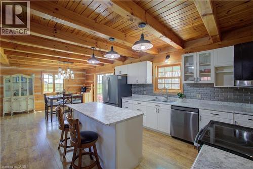 Updated kitchen with breakfast island, new appliances and connected to a pantry/laundry space - 802080 Grey Road 40, Chatsworth (Twp), ON - Indoor Photo Showing Kitchen With Stainless Steel Kitchen