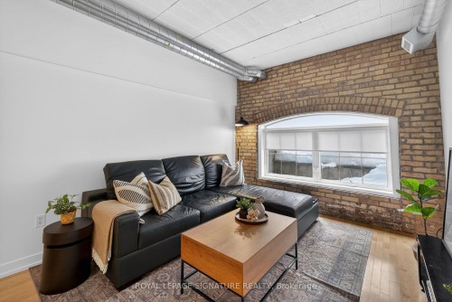 213-1100 Lansdowne Avenue, Toronto, ON - Indoor Photo Showing Living Room With Fireplace