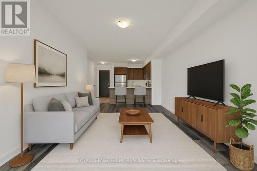 Virtually Staged - 216 - 50 Lakebreeze Drive, Clarington (Newcastle), ON - Indoor Photo Showing Living Room
