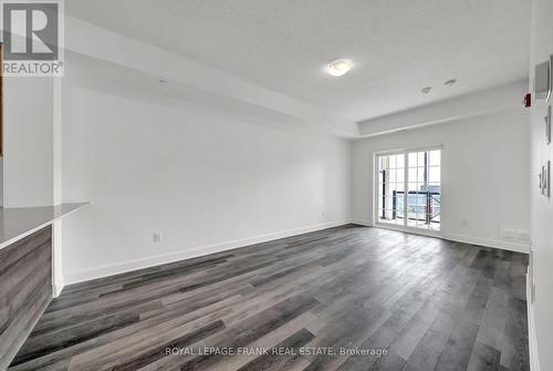 Walk-out to balcony with lake views - 216 - 50 Lakebreeze Drive, Clarington (Newcastle), ON - Indoor Photo Showing Other Room