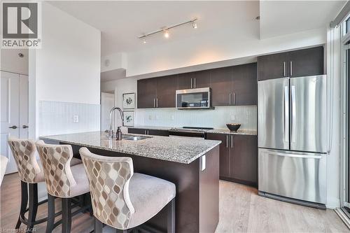 55 Speers Road Unit# 1709, Oakville, ON - Indoor Photo Showing Kitchen With Stainless Steel Kitchen With Double Sink