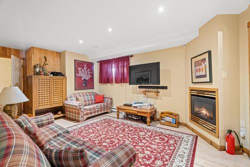 Salle familiale - 38 Imp. Denise, Lac-Supérieur, QC - Indoor Photo Showing Living Room With Fireplace