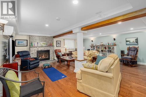 Rec-room Lower Level - 3 Topsail Heights, Conception Bay South, NL - Indoor Photo Showing Living Room With Fireplace