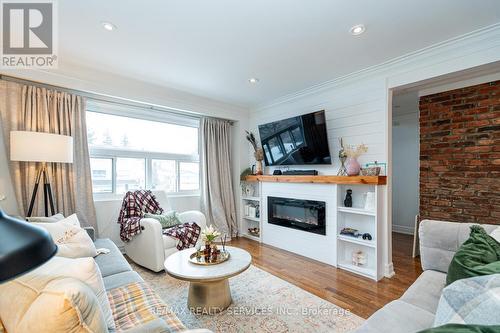 145 - 1050 Shawnmarr Road, Mississauga, ON - Indoor Photo Showing Living Room With Fireplace