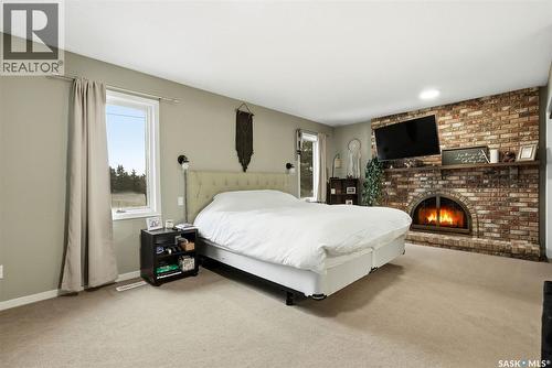 2402 Truesdale Drive, Regina, SK - Indoor Photo Showing Bedroom With Fireplace