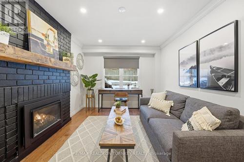 Large windows fill the space with light - 196 Orchard Heights Boulevard, Aurora, ON - Indoor Photo Showing Living Room With Fireplace