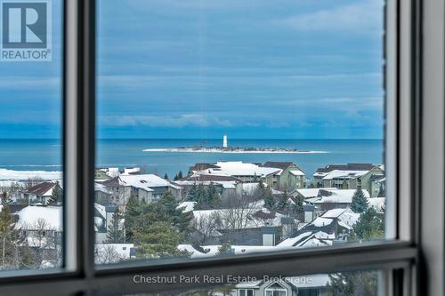 Views of the lighthouse from the guest bedroom - 1001 - 24 Ramblings Way, Collingwood, ON - Indoor Photo Showing Other Room With Body Of Water