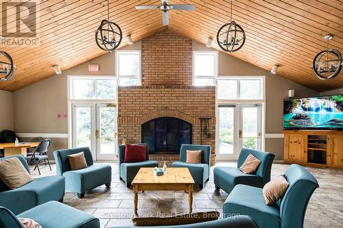 Lounge in the recreation centre - 1001 - 24 Ramblings Way, Collingwood, ON - Indoor Photo Showing Living Room With Fireplace