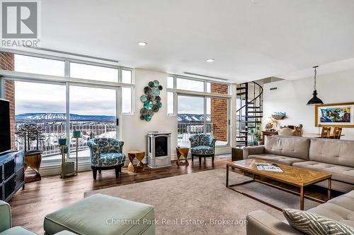 Amazing views and floor to ceiling windows - 1001 - 24 Ramblings Way, Collingwood, ON - Indoor Photo Showing Living Room