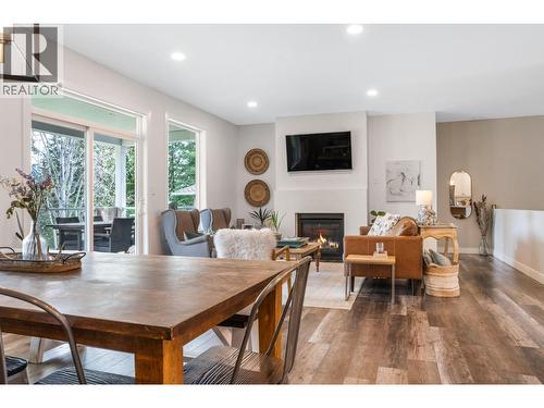 2741 Golf Course Drive, Blind Bay, BC - Indoor Photo Showing Dining Room With Fireplace