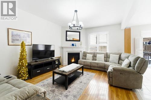 12 Gaudi Road, Toronto, ON - Indoor Photo Showing Living Room With Fireplace