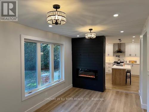 86 Doran Road, Springwater, ON - Indoor With Fireplace