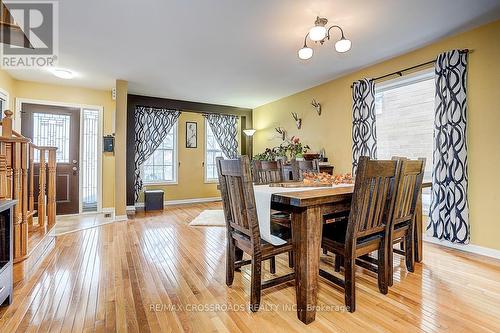 597 Caverhill Crescent, Milton, ON - Indoor Photo Showing Dining Room With Fireplace