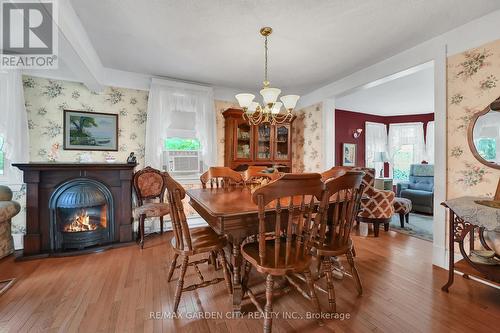 110 Livingston Avenue, Grimsby, ON - Indoor Photo Showing Dining Room With Fireplace