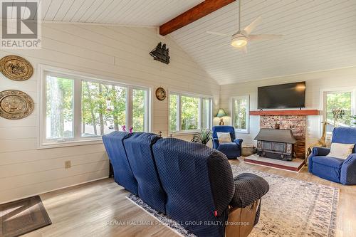 383 Peek-A-Boo Trail, Tiny, ON - Indoor Photo Showing Living Room With Fireplace