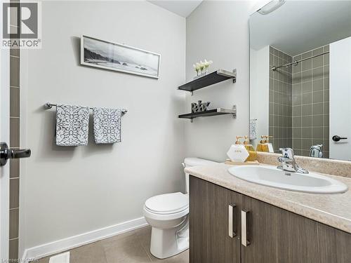 Bathroom with vanity, light tile patterned floors, and a shower - 98 Crafter Crescent, Stoney Creek, ON - Indoor Photo Showing Bathroom