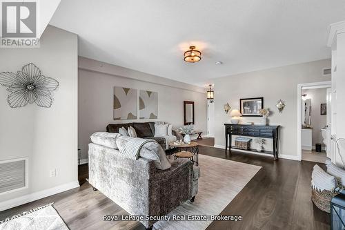 217 - 54 Koda Street, Barrie, ON - Indoor Photo Showing Living Room With Fireplace