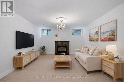 Virtually Staged - 3286 Shelburne Place, Oakville (Br Bronte), ON - Indoor Photo Showing Living Room With Fireplace